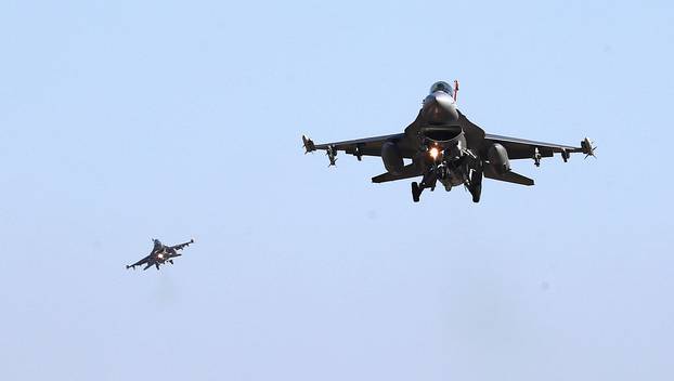 U.S. Air Force F-16 fighter jets fly over the Osan Air Base in Pyeongtaek