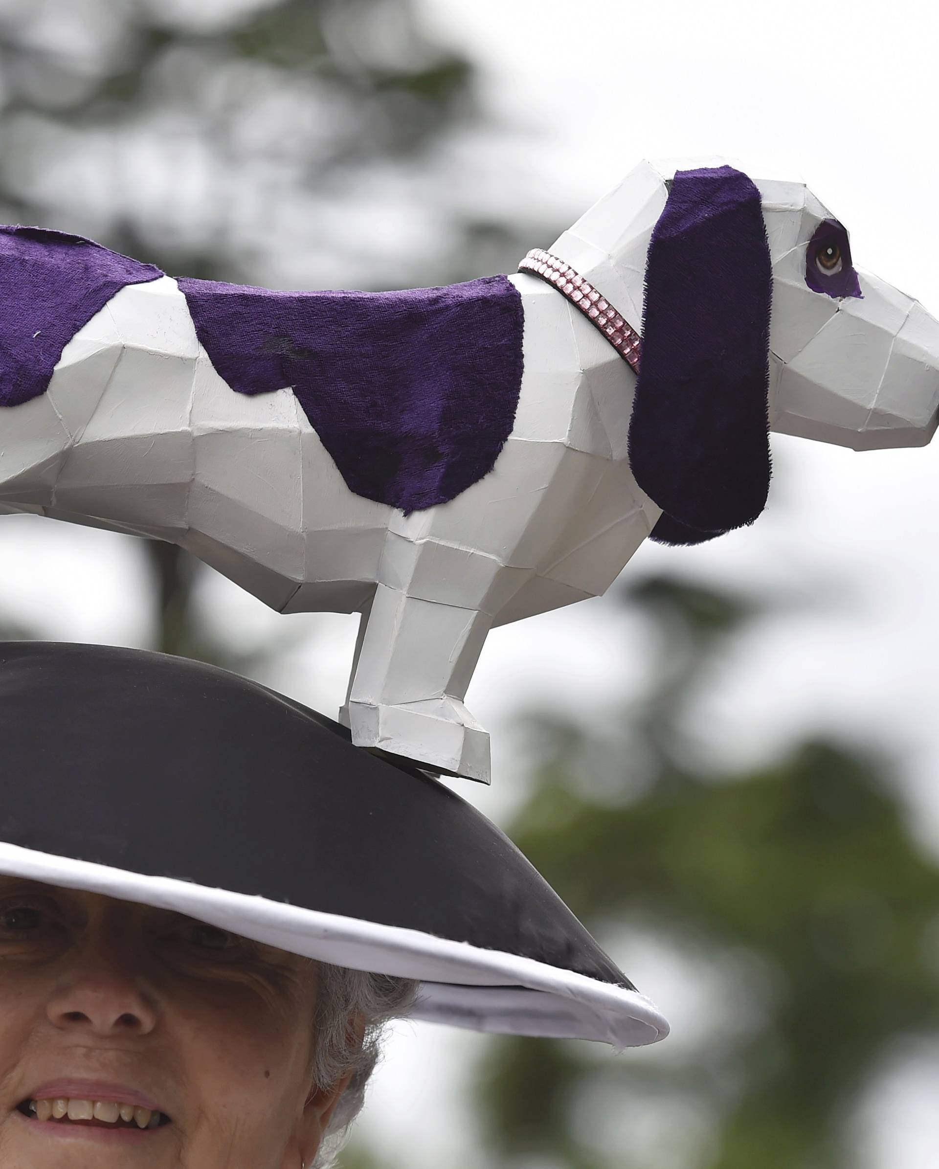 Britain Horse Racing Ladies Day Racegoer wears hat