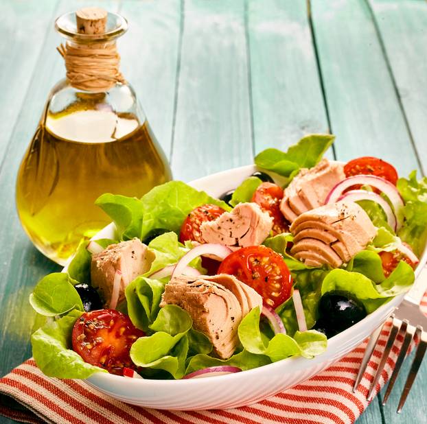 Fresh,Tuna,Salad,With,Olive,Oil,Dressing,In,A,Glass