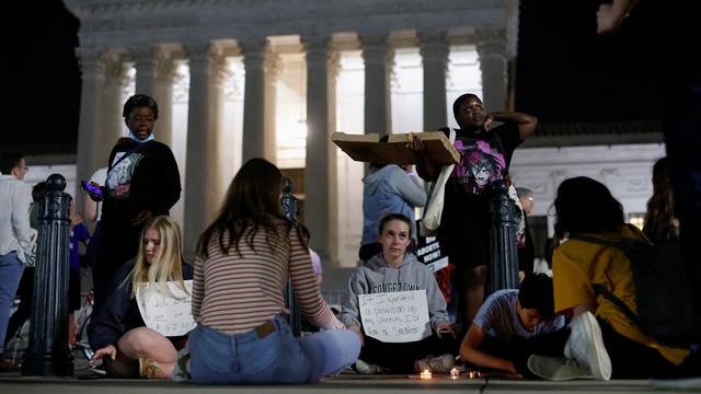 Protesters react outside the U.S. Supreme Court after the leak of a draft opinion preparing for a majority of the court to overturn the Roe v. Wade abortion rights decision in Washington
