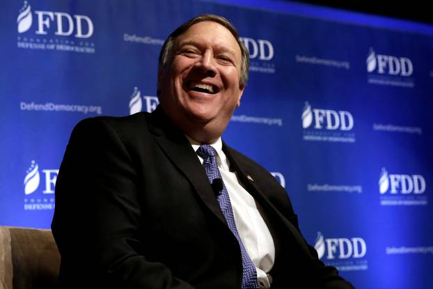 FILE PHOTO: CIA Director Mike Pompeo laughs during the FDD National Security Summit in Washington