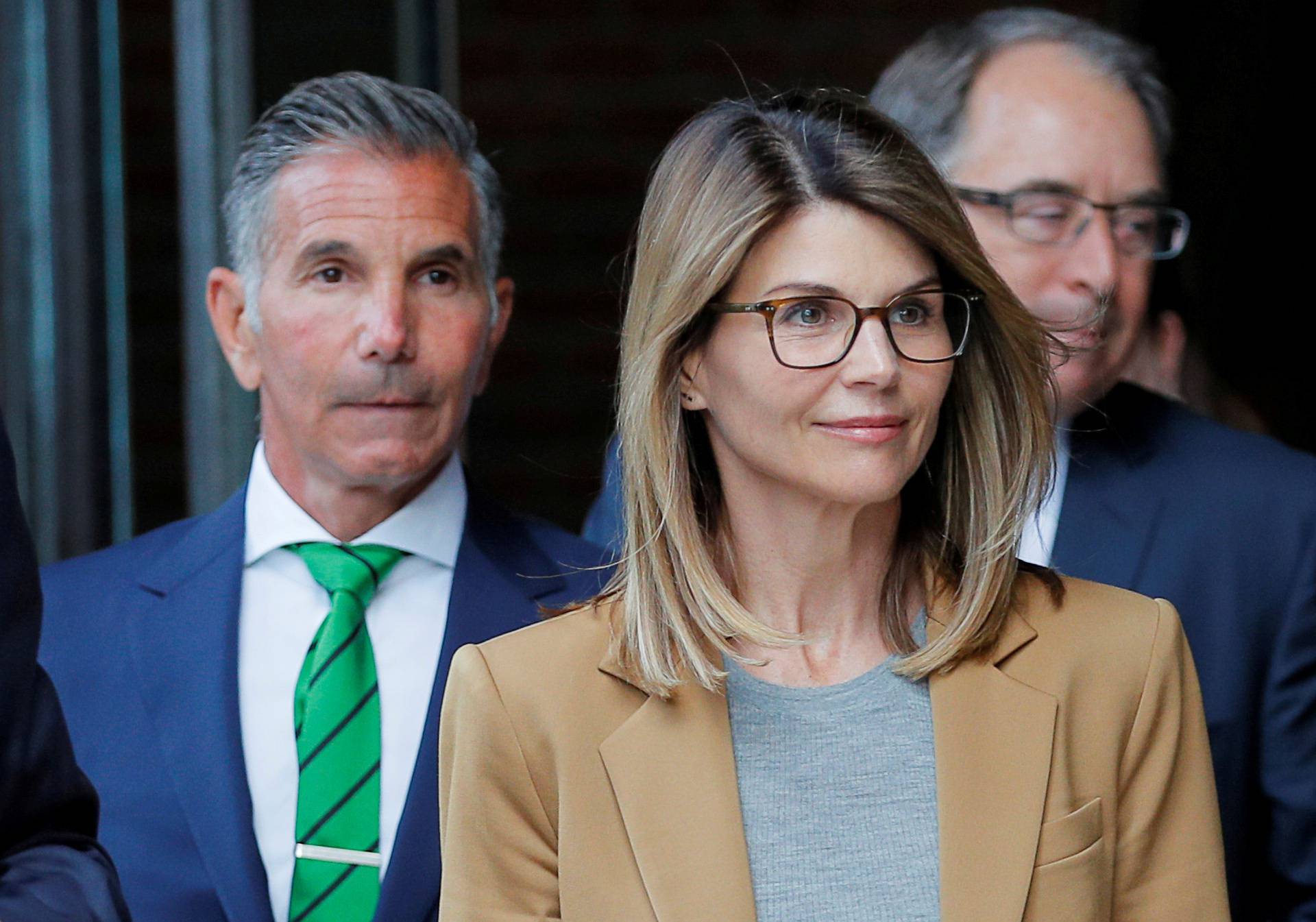 FILE PHOTO: Actor Lori Loughlin and her husband Mossimo Giannulli leave the federal courthouse in Boston