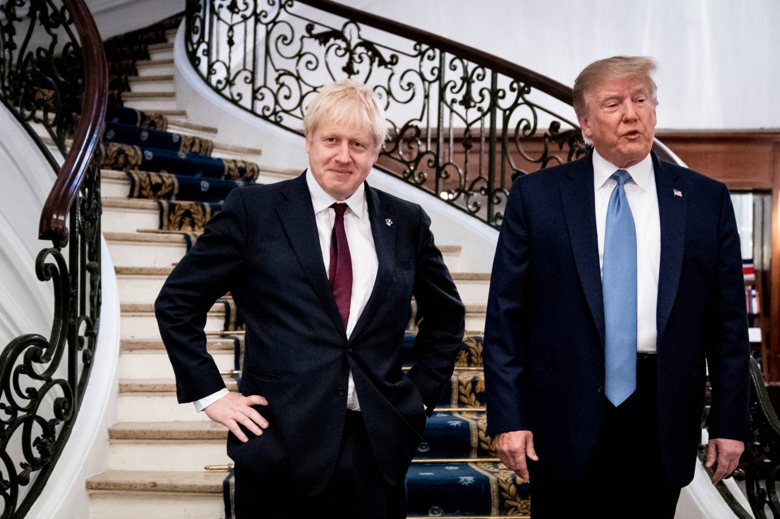 FILE PHOTO: U.S. President Donald Trump and Britain's Prime Minister Boris Johnson arrive for a bilateral meeting during the G7 summit in Biarritz, France