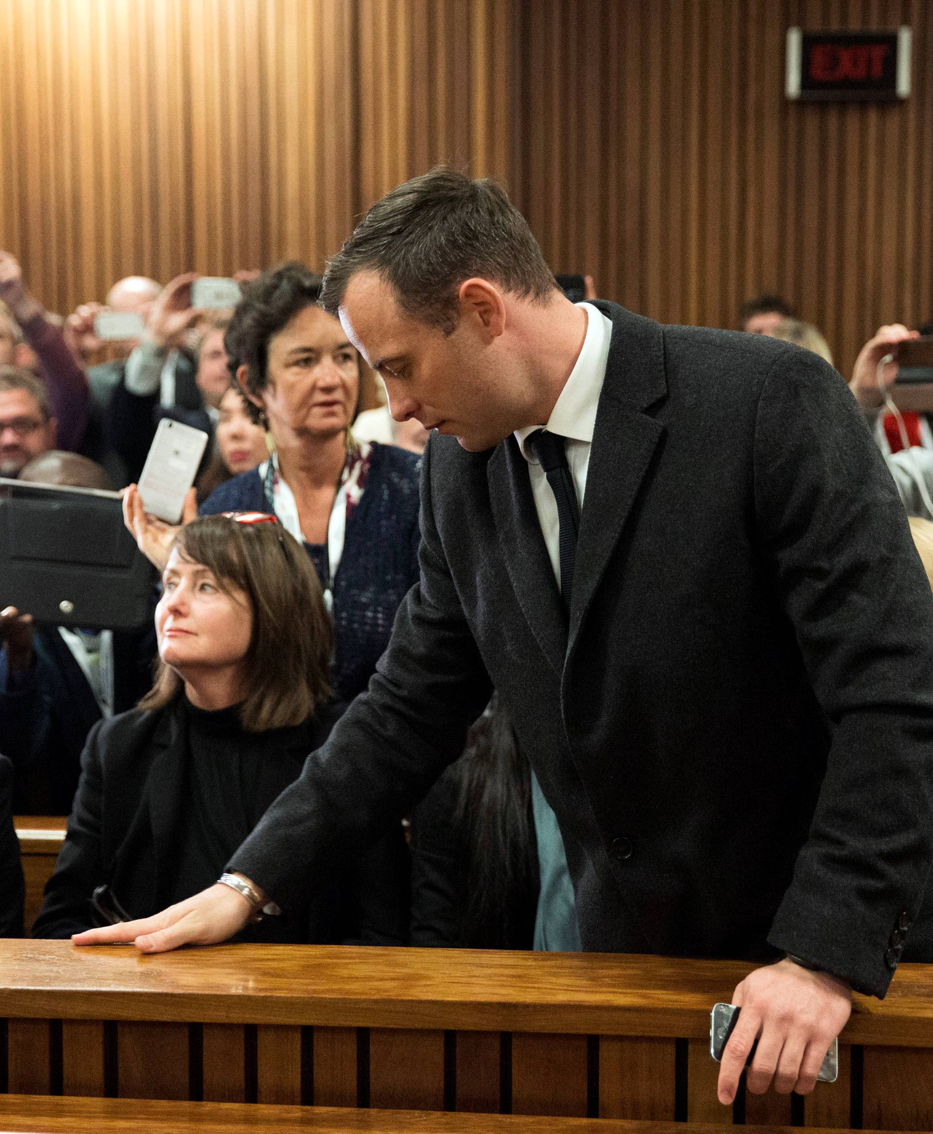 Olympic and Paralympic track star Oscar Pistorius arrives for sentencing at the North Gauteng High Court in Pretoria