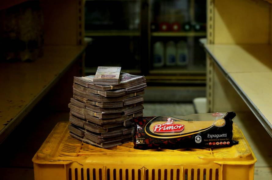 The Wider Image: Venezuelans rush to shops before monetary overhaul