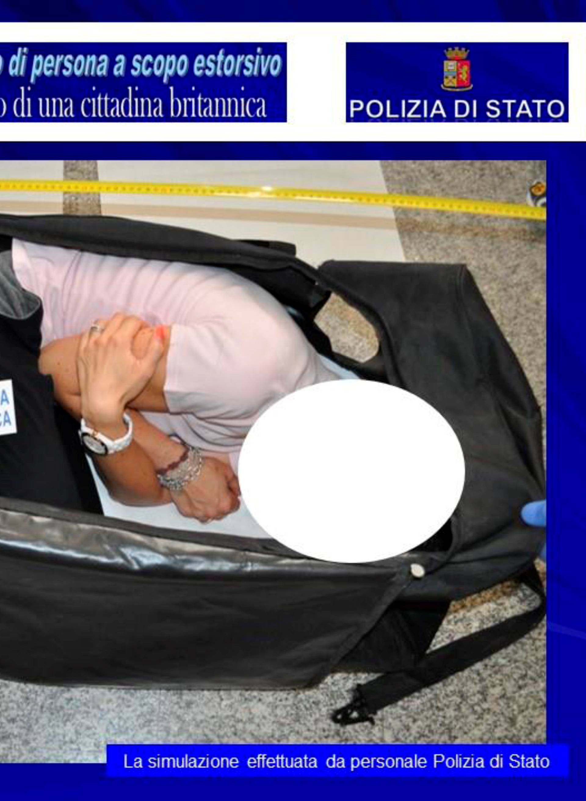 Italian police handout shows a person taking part in a reenactment by Italian police on how a kidnapped British model was kept in a bag