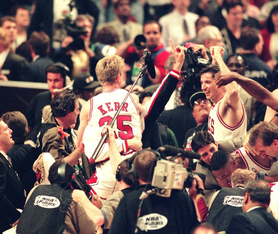 NBA Finals action Seattle Supersonics at the Chicago Bulls Game 6 in 1996. Steve Kerr and Tony Kukoc celebrate on the shoulders of teammates after the game.