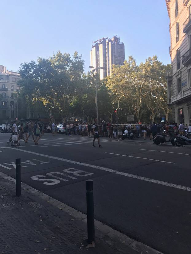 People pictured on Las Ramblas after a van crashed into crowds in Barcelona