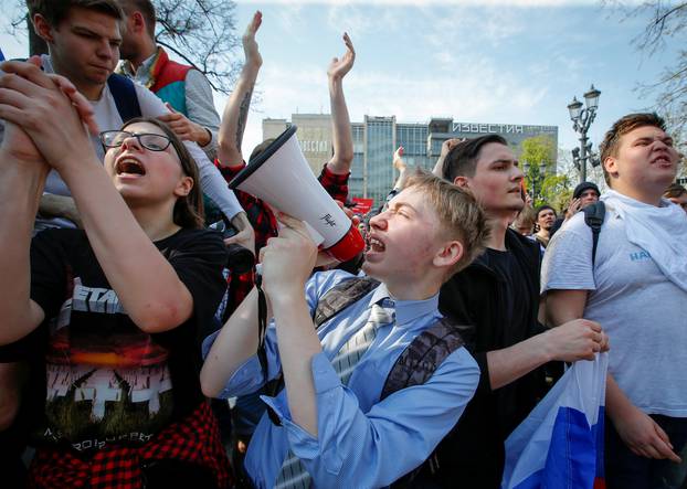 Opposition supporters attend a protest rally ahead of President Vladimir Putin