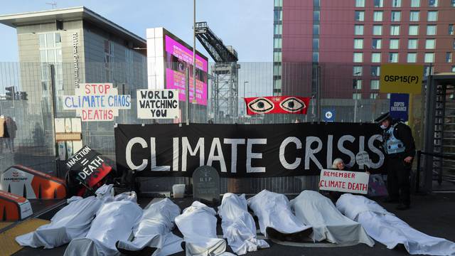 People protest outside the UN Climate Change Conference (COP26) venue in Glasgow Scotland