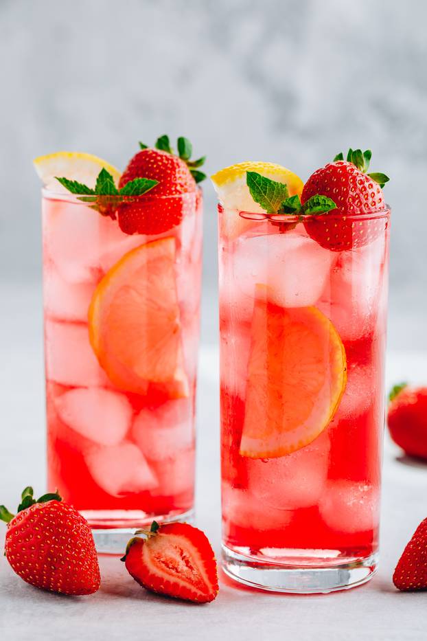 Refreshing Strawberry Mint and lemon Iced Tea or lemonade in glasses 