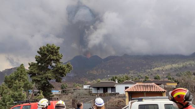 A cloud of smoke and ash is seen as volcanic explosions intensified on the Canary Island of La Palma