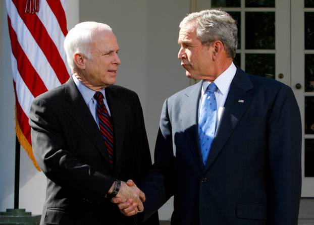 FILE PHOTO -  U.S. President Bush and presumptive Republican presidential nominee McCain shake hands after meeting at White House in Washington