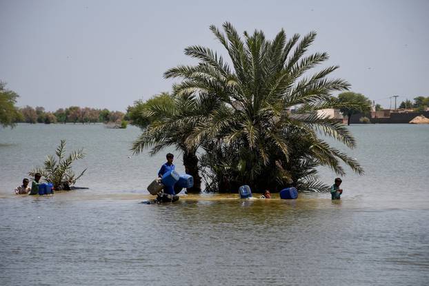 Flooding during monsoon season in Bajara village, Sehwan