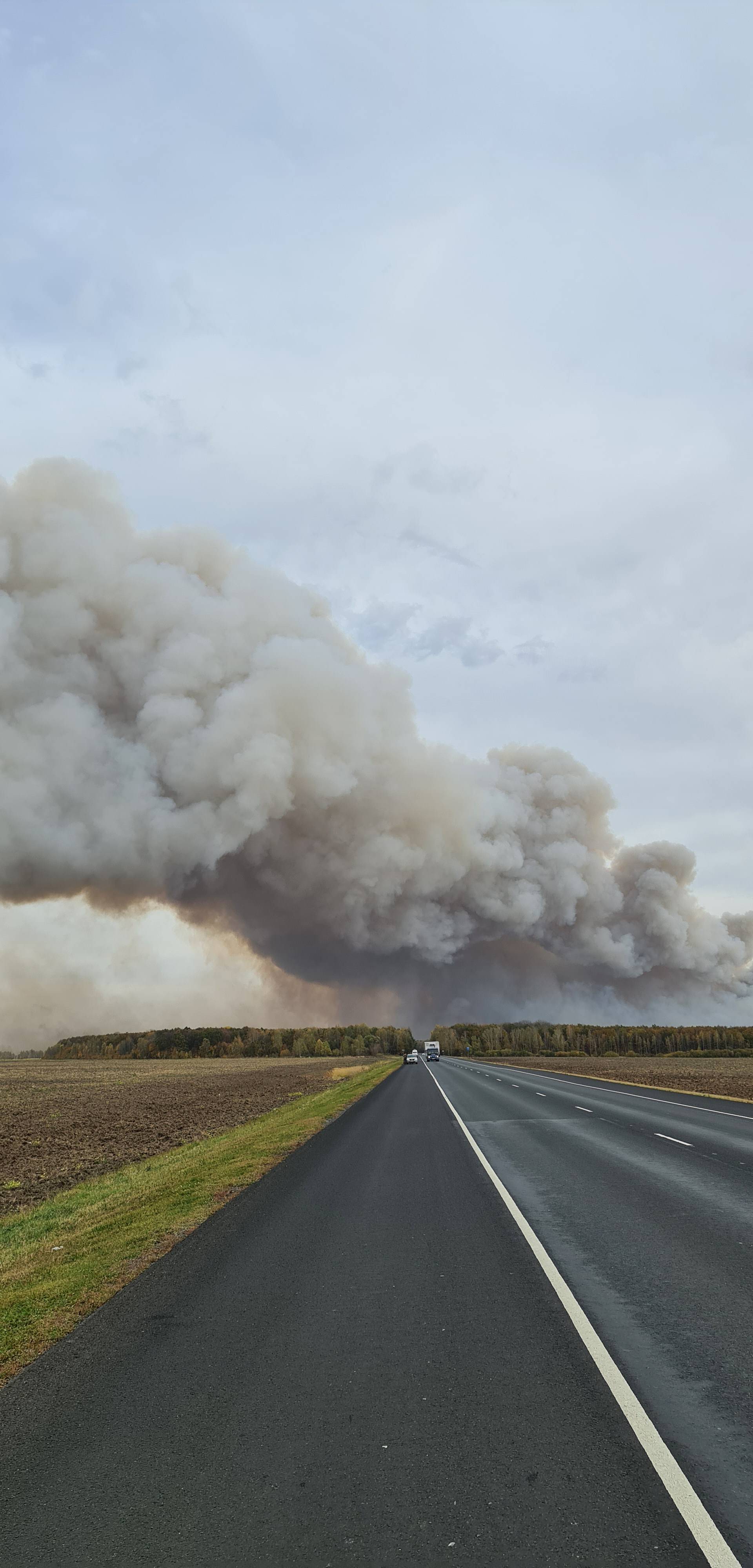 Smoke rises from the site of a fire at an ammunition depot in Ryazan Region
