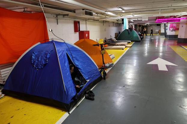 Israelis hold a Passover Seder in an underground parking garage used as a public bomb shelter, in Tel Aviv