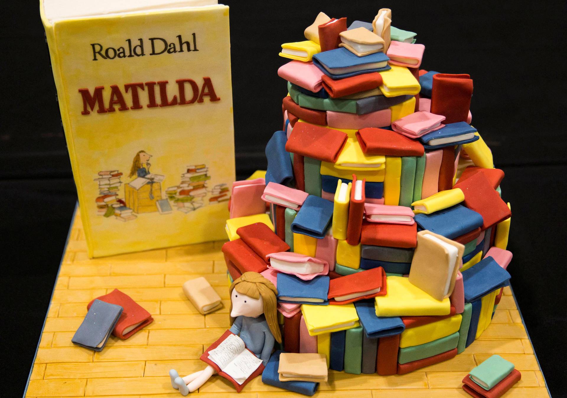 FILE PHOTO: A cake decorated in the style of the Roald Dahl children's book "Matilda" is displayed at the Cake and Bake show in London, Britain