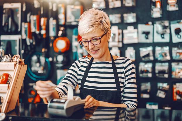 Smiling,Caucasian,Female,Worker,With,Short,Blonde,Hair,And,Eyeglasses