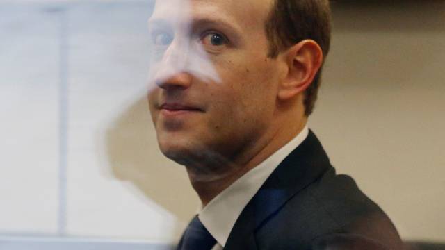 Facebook CEO Zuckerberg waits to meet with Senator Nelson on Capitol Hill in Washington