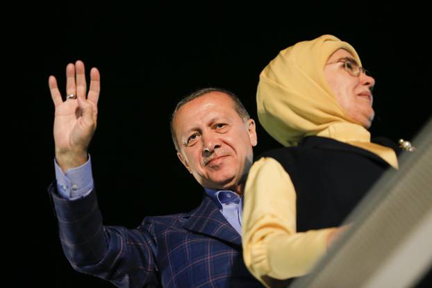 Turkish President Tayyip Erdogan with his wife Emine greet supporters near Tarabya mansion in Istanbul,