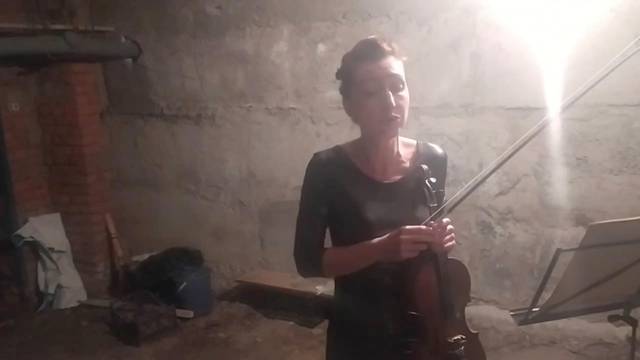 Violinist plays her violin in a bomb shelter in Kharkiv