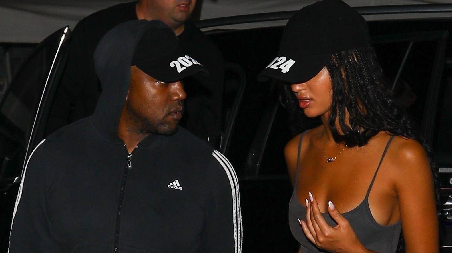 *PREMIUM-EXCLUSIVE* Kanye West is back on the dating scene as he arrives at a clothing factory with a mystery woman both wearing 2024 hats! **WEB EMBARGO UNTIL 9:30 PM ET on October 10, 2022**