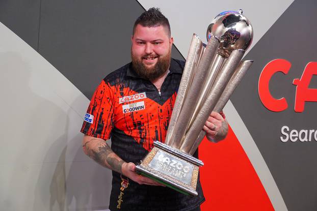 LONDON, UNITED KINGDOM - JANUARY 4: Michael Smith of England poses with the Sid Waddell Trophy during Day Seven of the Cazoo World Darts Championship at Alexandra Palace on December 21, 2022 in London, England. (Photo by Pieter Verbeek/BSR Agency) Credit: