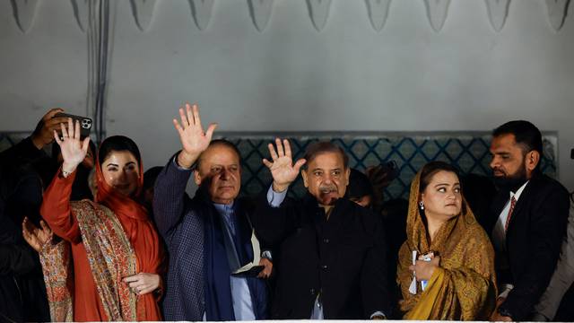 Supporters of Former Prime Minister of Pakistan Nawaz Sharif cheer as they gather at the party office of Pakistan Muslim League (N) at Model Town in Lahore