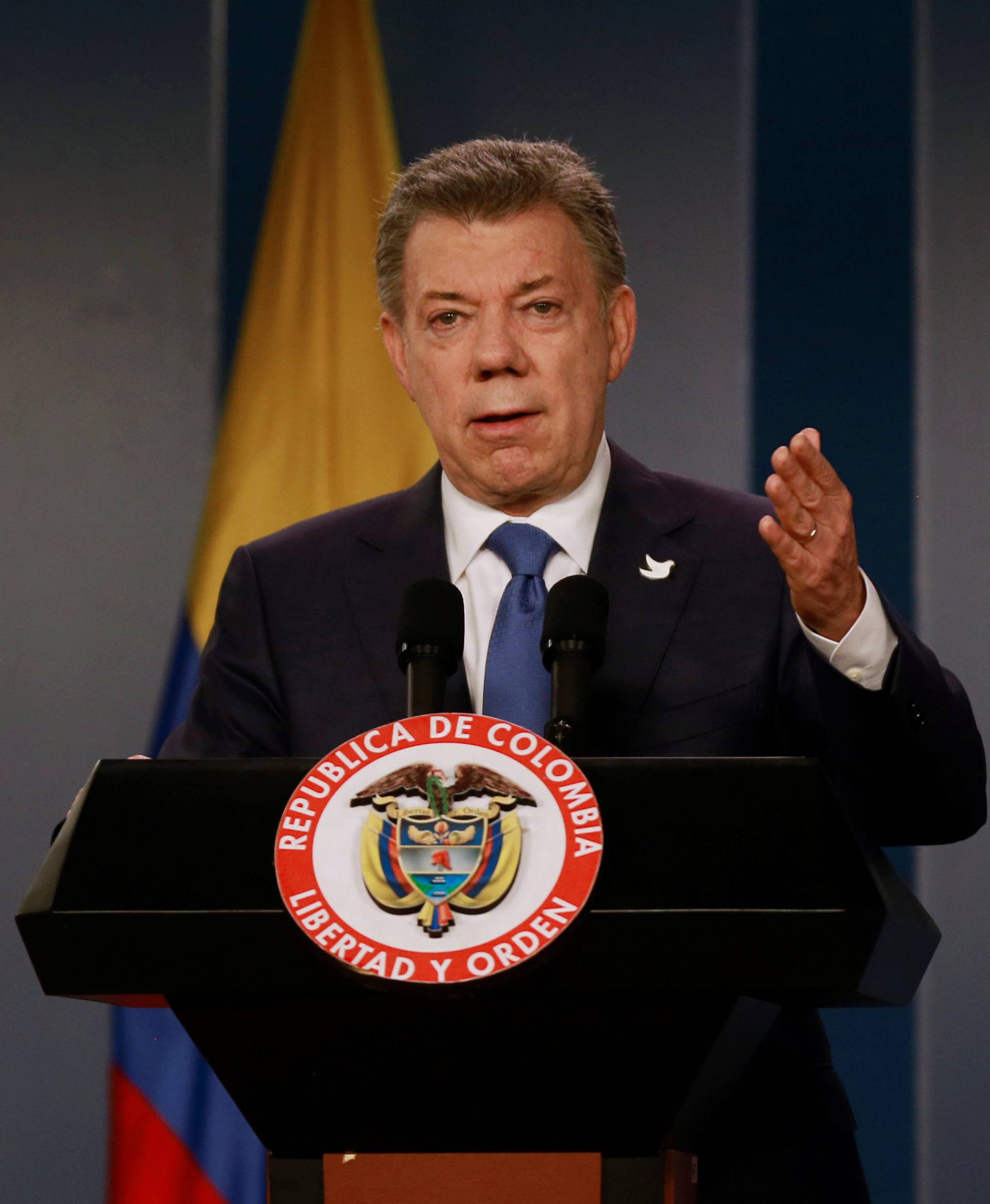 Colombia's President Santos talks during a news conference after a meeting with Colombian former President and Senator Uribe at Narino Palace in Bogota, Colombia