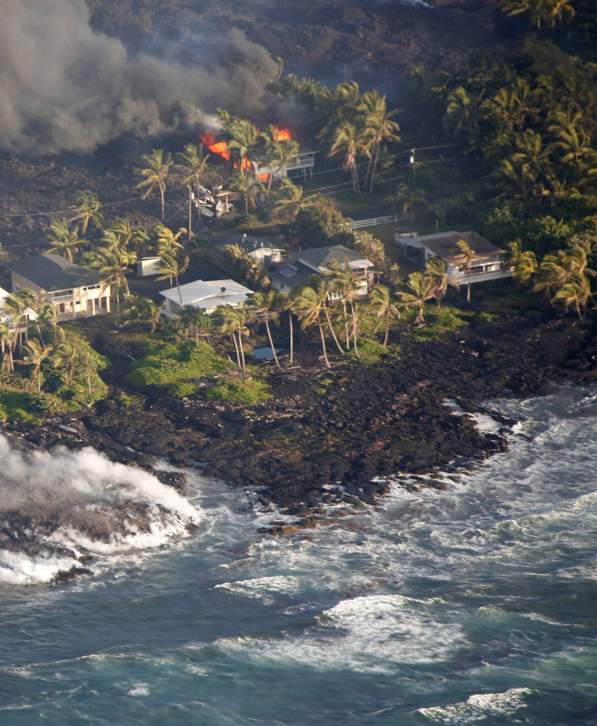Lava destroys homes in the Kapoho area, east of Pahoa