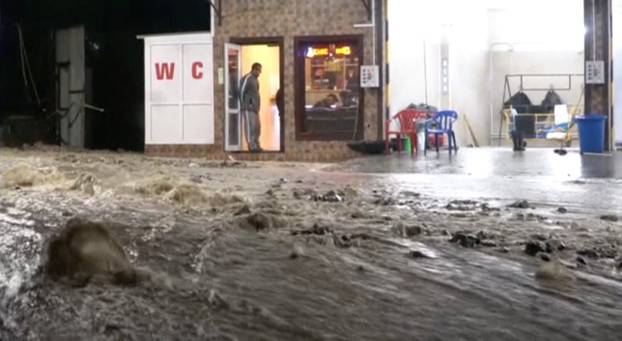 A still image shows a street in a settlement affected by floodwaters in Krasnodar Region