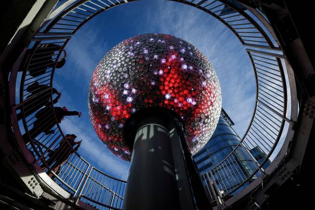A newly created New Year's eve ball is raised for the first time above One Times Square ahead of the New Year's Eve ball drop in New York