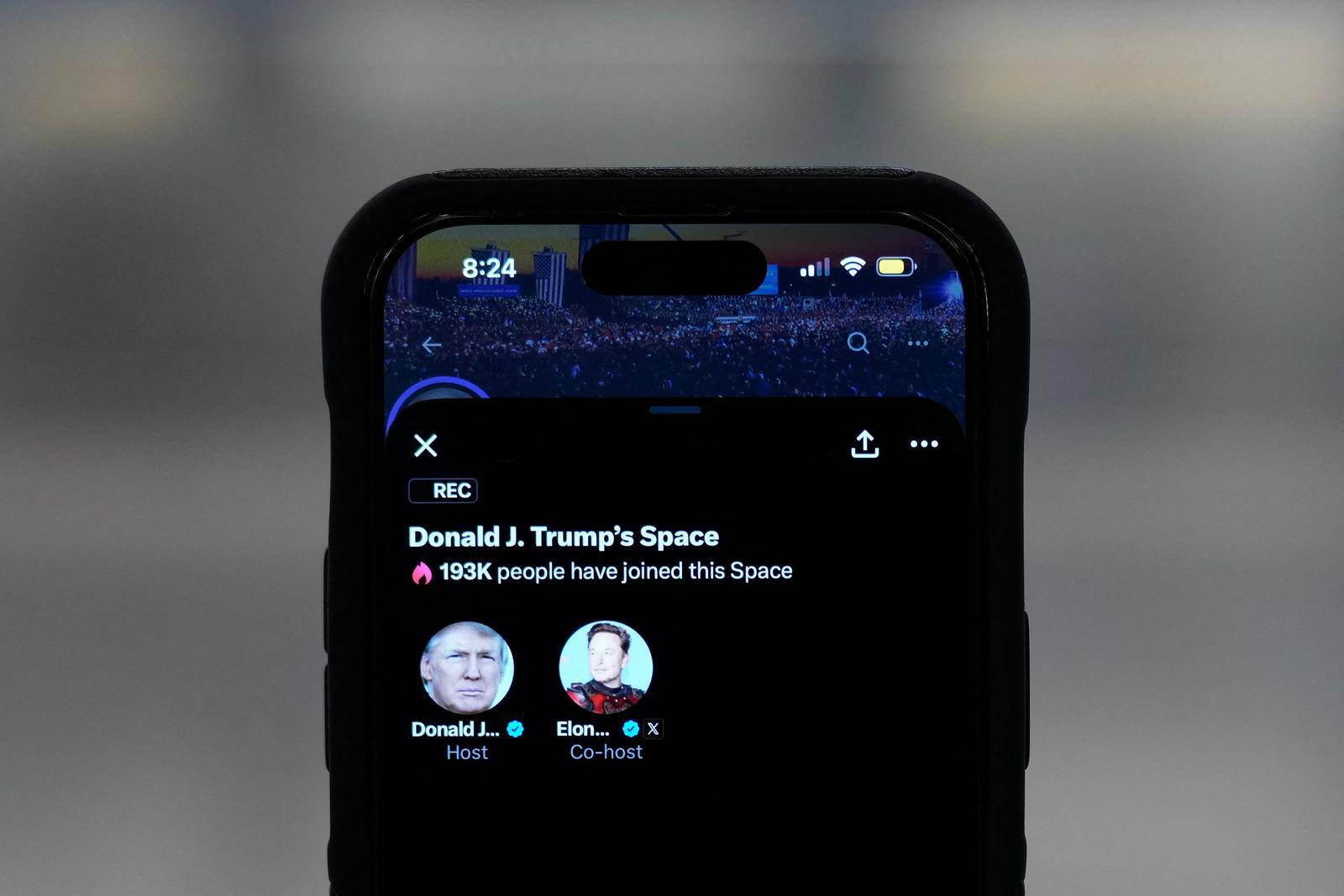 Illustration shows an iPhone with Republican presidential candidate and former U.S. President Donald Trump’s X Space and billionaire entrepreneur Elon Musk as a co-host