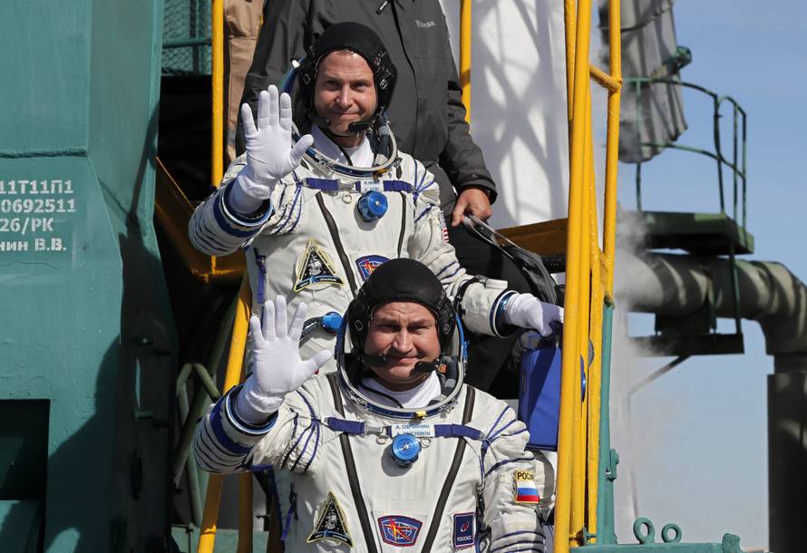 International Space Station (ISS) crew members board the Soyuz MS-10 spacecraft for the launch at the Baikonur Cosmodrome, Kazakhstan