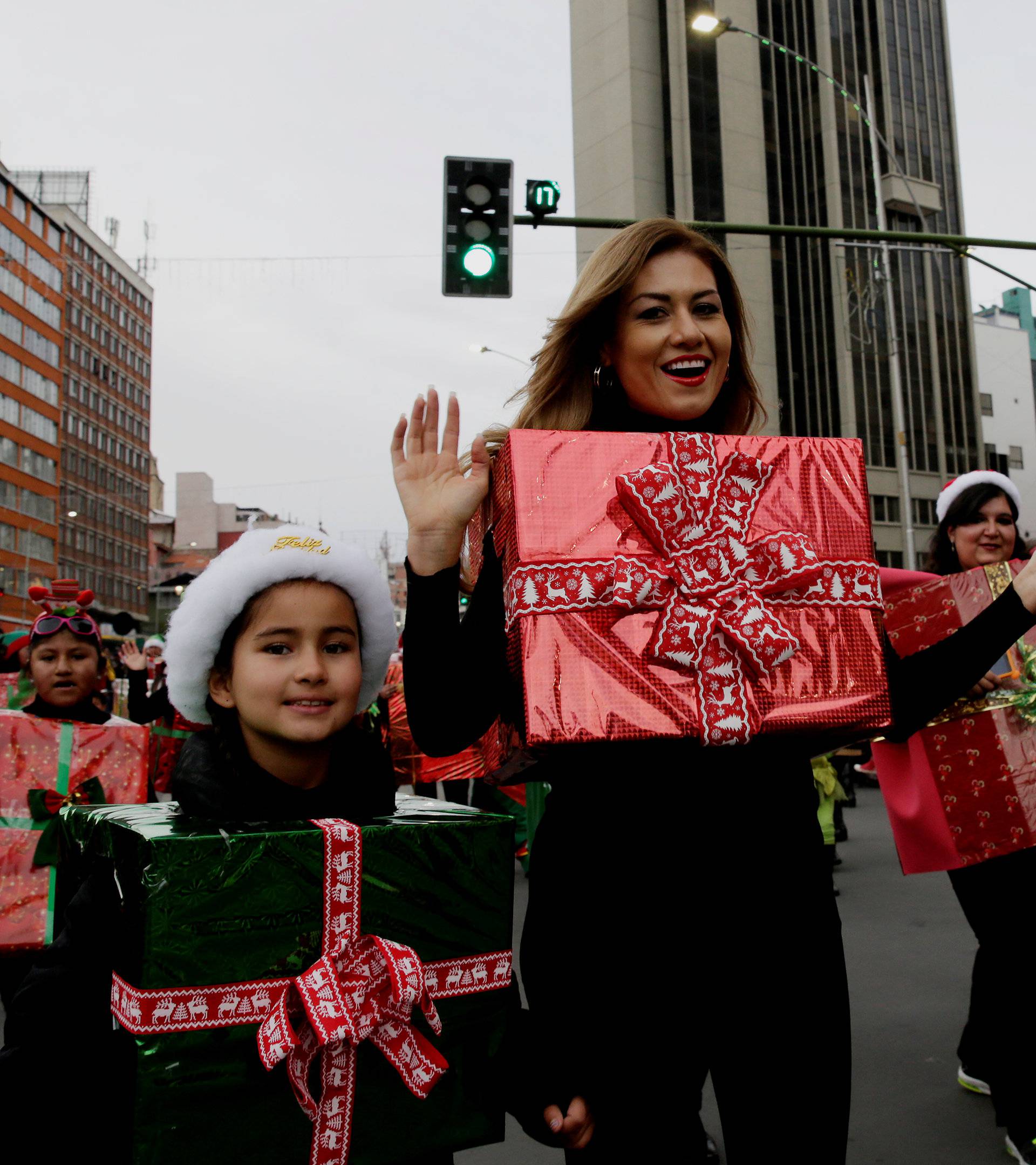 Residents participate in a Christmas parade in La Paz