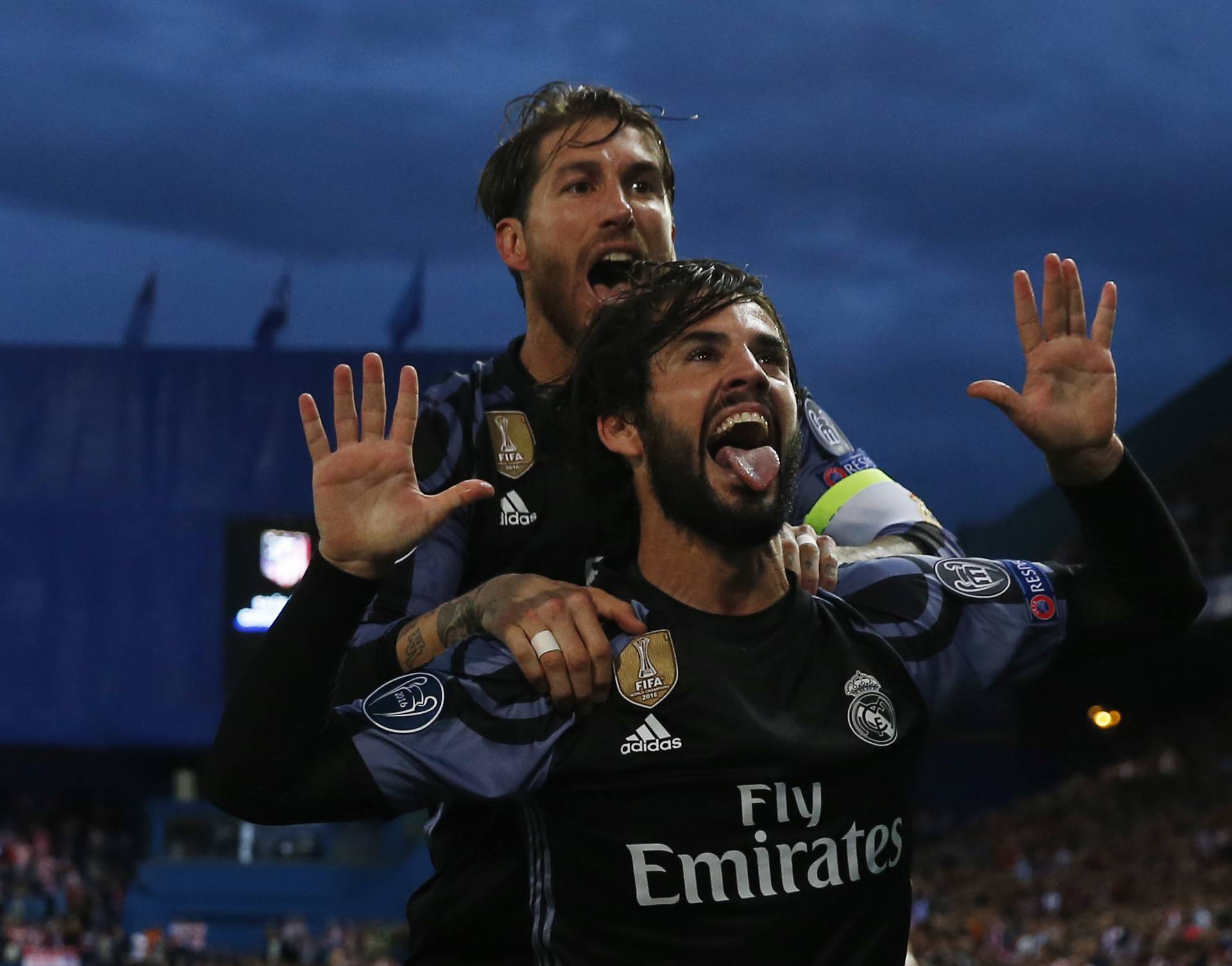 Real Madrid's Isco celebrates scoring their first goal with Sergio Ramos