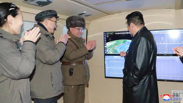 North Korean leader Kim Jong Un observes what state media report is a hypersonic missile test at an undisclosed location in North Korea