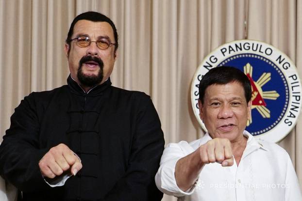 President Rodrigo Duterte with visiting American actor Steven Seagal (L) gestures during his courtesy call at the Malacanang presidential palace in Manila