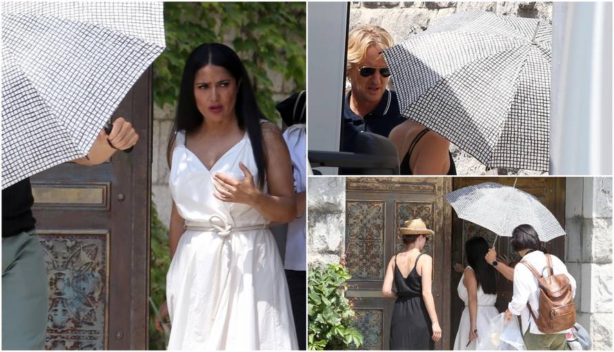 Zatvorili ulicu: Owena i Salmu štite kišobranima od paparazza