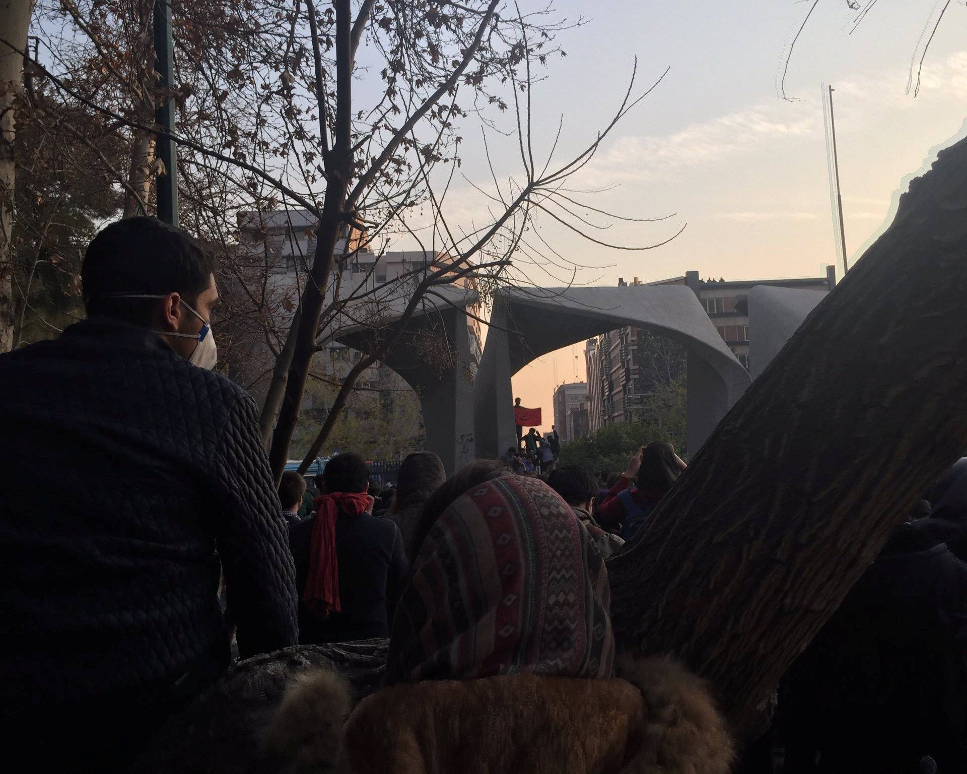 People protest near the university of Tehran