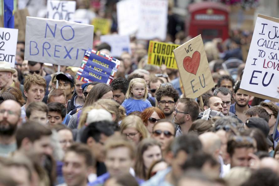 People hold banners during a demonstration against Britain's decision to leave the European Union, in central London