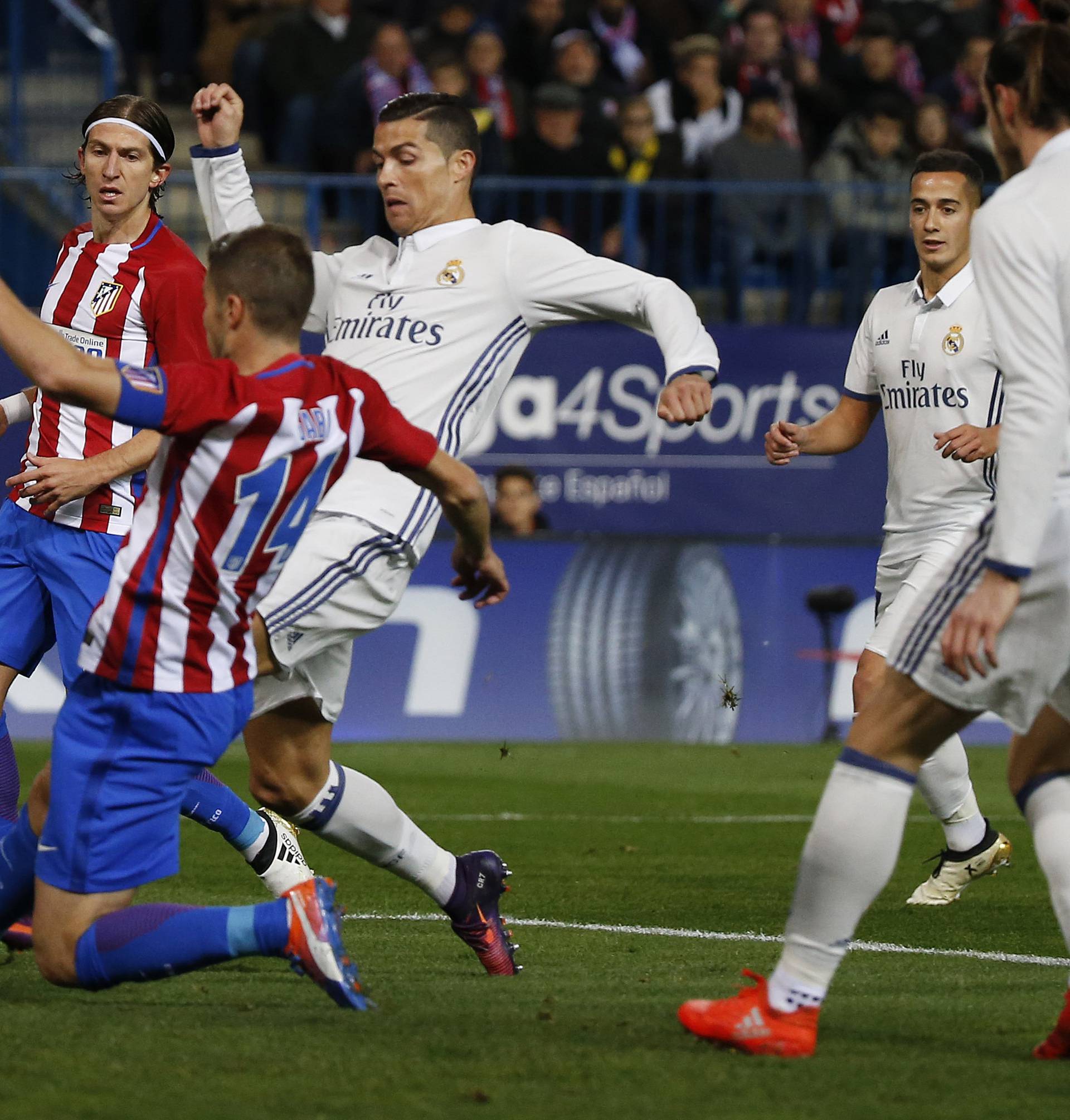 Real Madrid's Cristiano Ronaldo in action with Atletico Madrid's Gabi