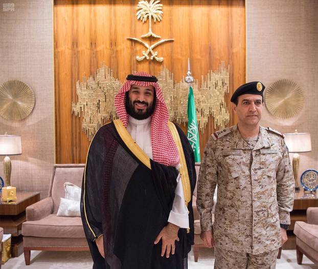 Saudi Crown Prince Mohammed bin Salman poses for a photo with Admiral Fahd bin Abdullah Al-Ghifaili after he was appointed as commander of Saudi Naval Forces, in Riyadh