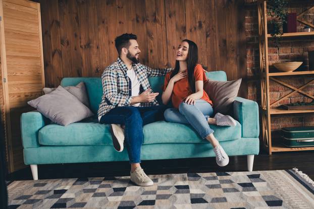 Photo of attractive joyful cheerful people spending break pause time together cozy lounge loft interior indoors