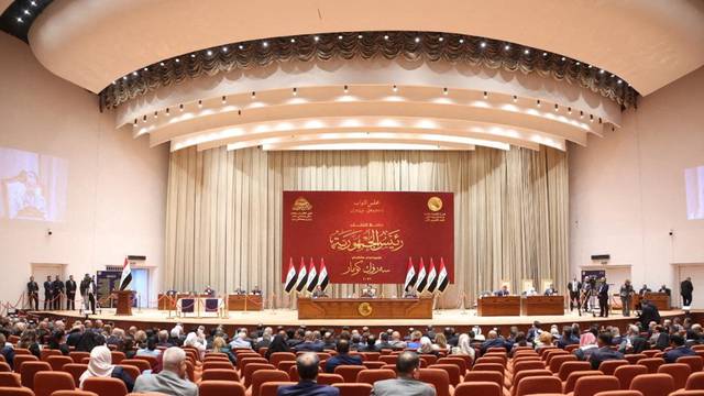 Iraqi lawmakers attend a parliamentary session to vote for a new head of state president in Baghdad