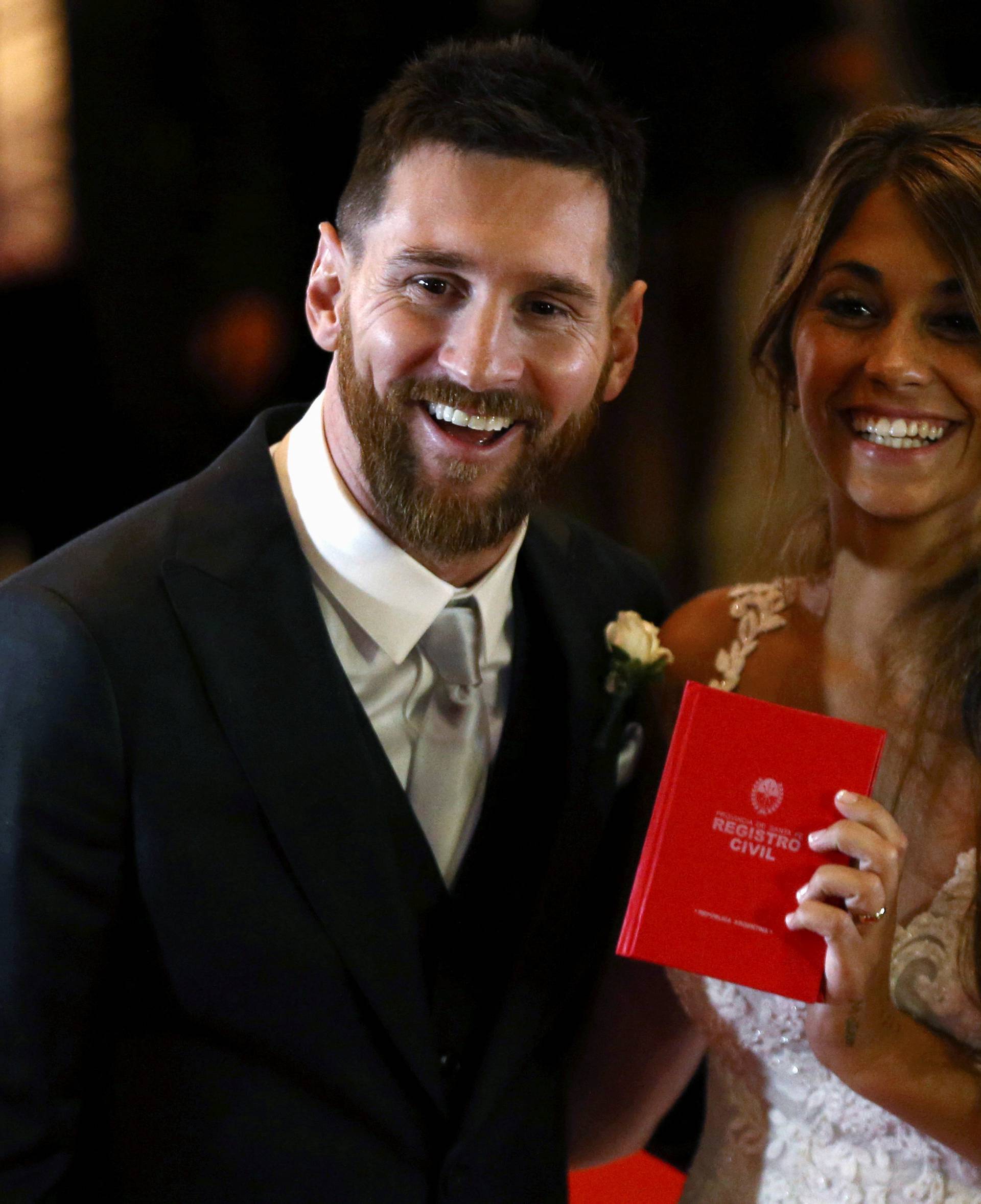 Argentine soccer player Lionel Messi and his wife Antonela Roccuzzo pose at their wedding in Rosario, Argentina