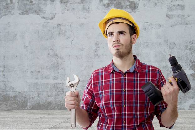builder tools and construction helmet