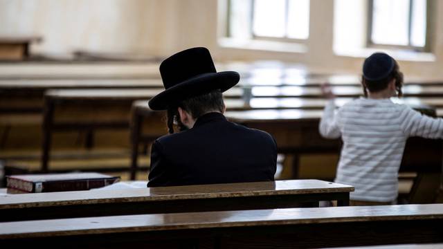FILE PHOTO: An Ultra Orthodox Jewish man sits in a religious study room in Jerusalem