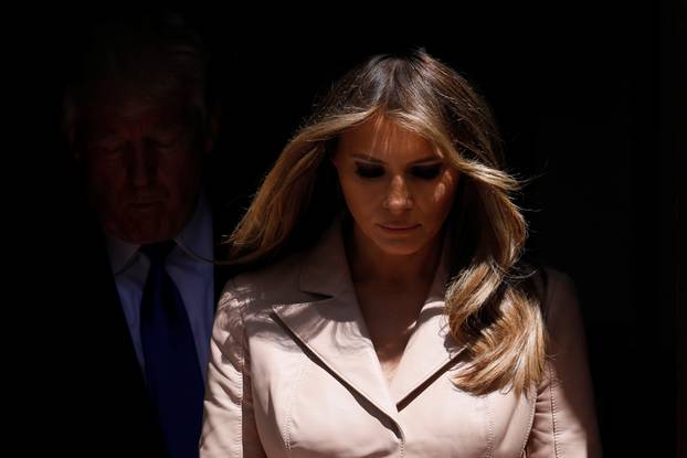 U.S. President Trump and first lady Melania Trump wait the arrival of French President Macron before a lunch ahead of a NATO Summit in Brussels