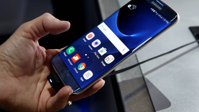 A Samsung S7 Edge Blue Coral smartphone is displayed during the 2017 CES in Las Vegas